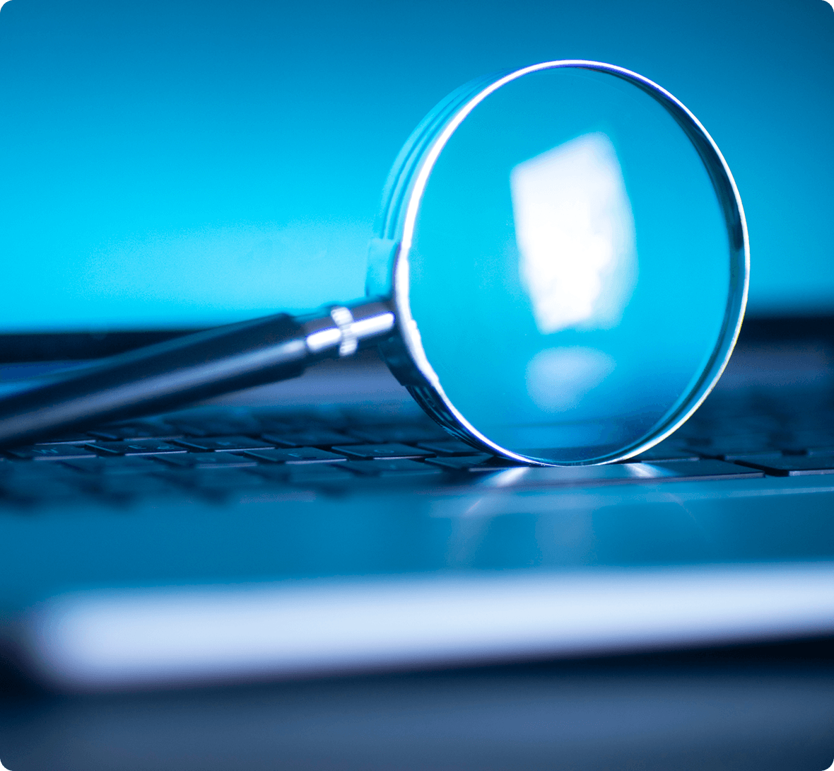Magnifying glass on a laptop keyboard