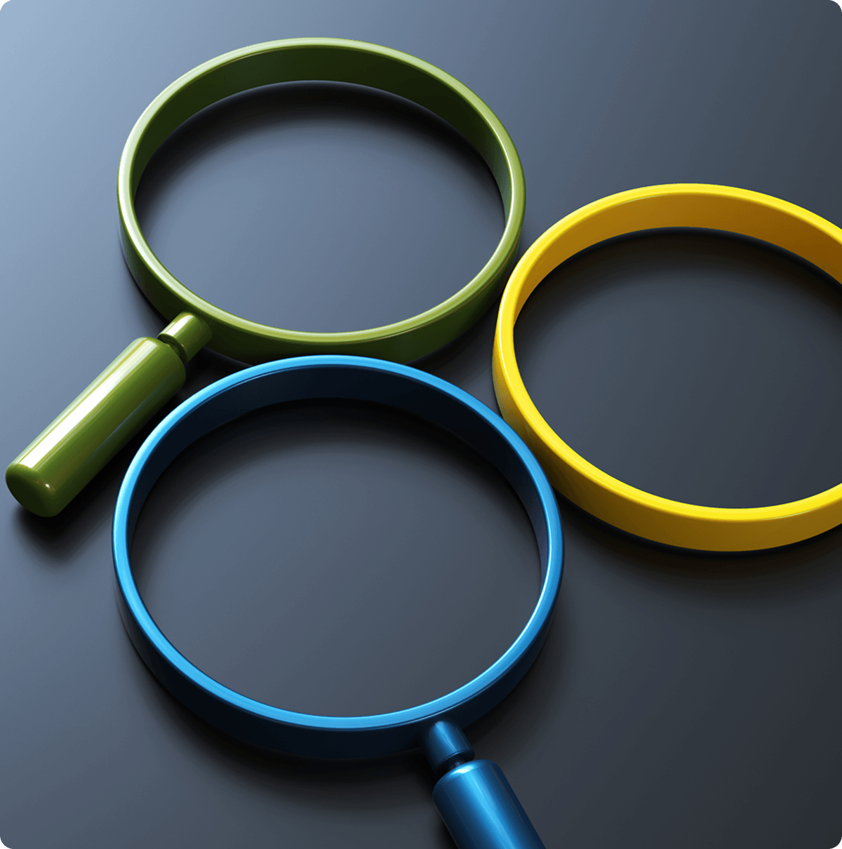 Colorful magnifying glasses on dark surface