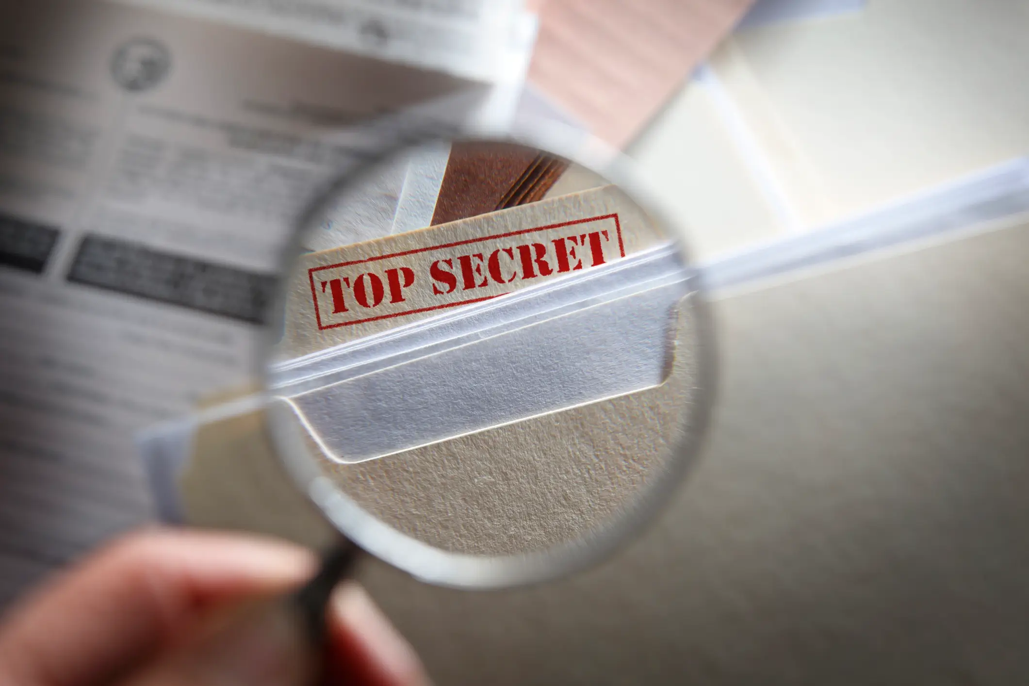 Top secret document under magnifying glass